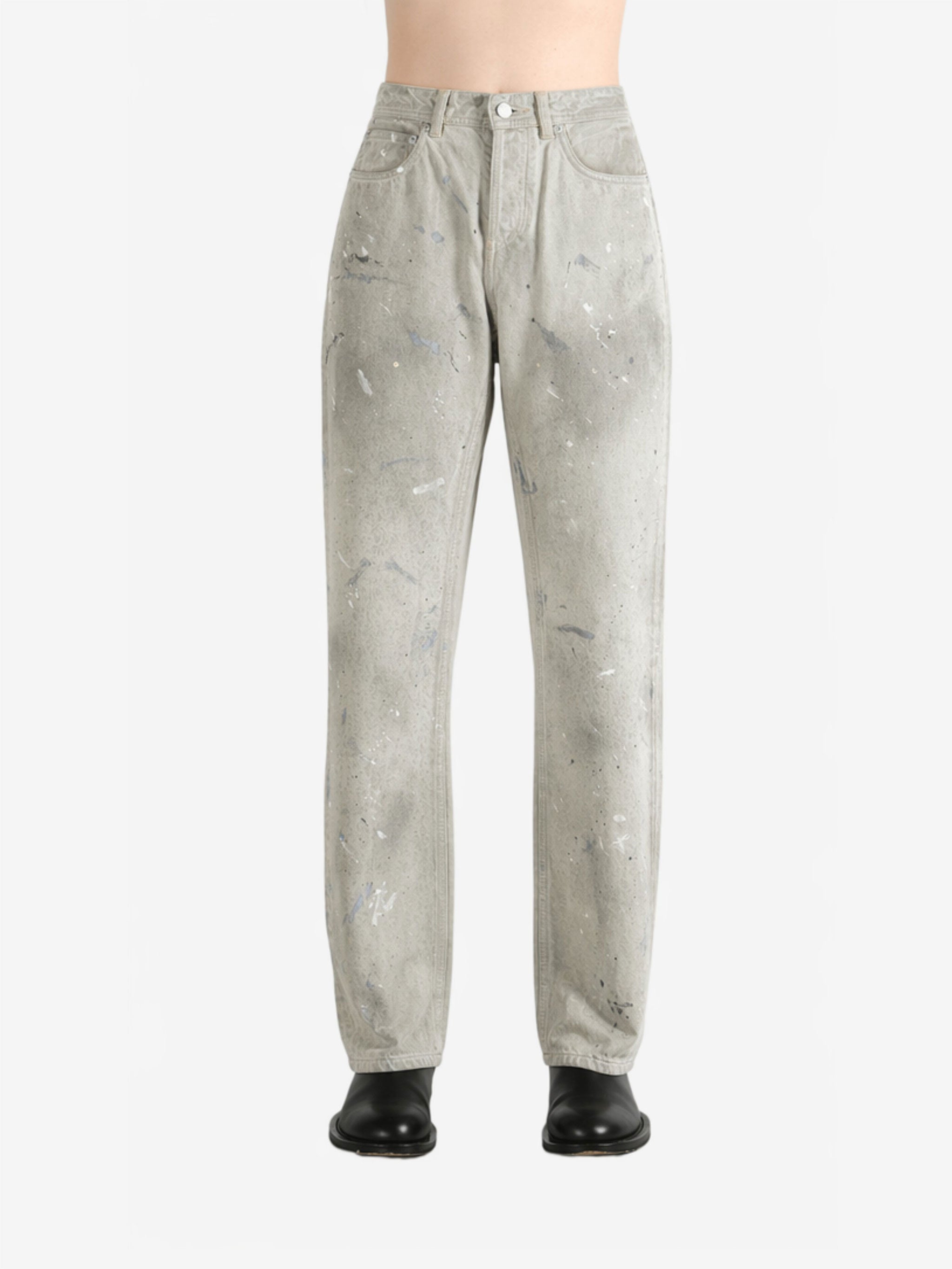 White jeans worn by a person, showing the jeans fit