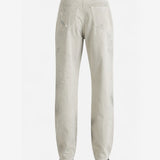 White jeans worn by a person, back view