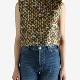 Brown top worn by a person, showing the top's fit