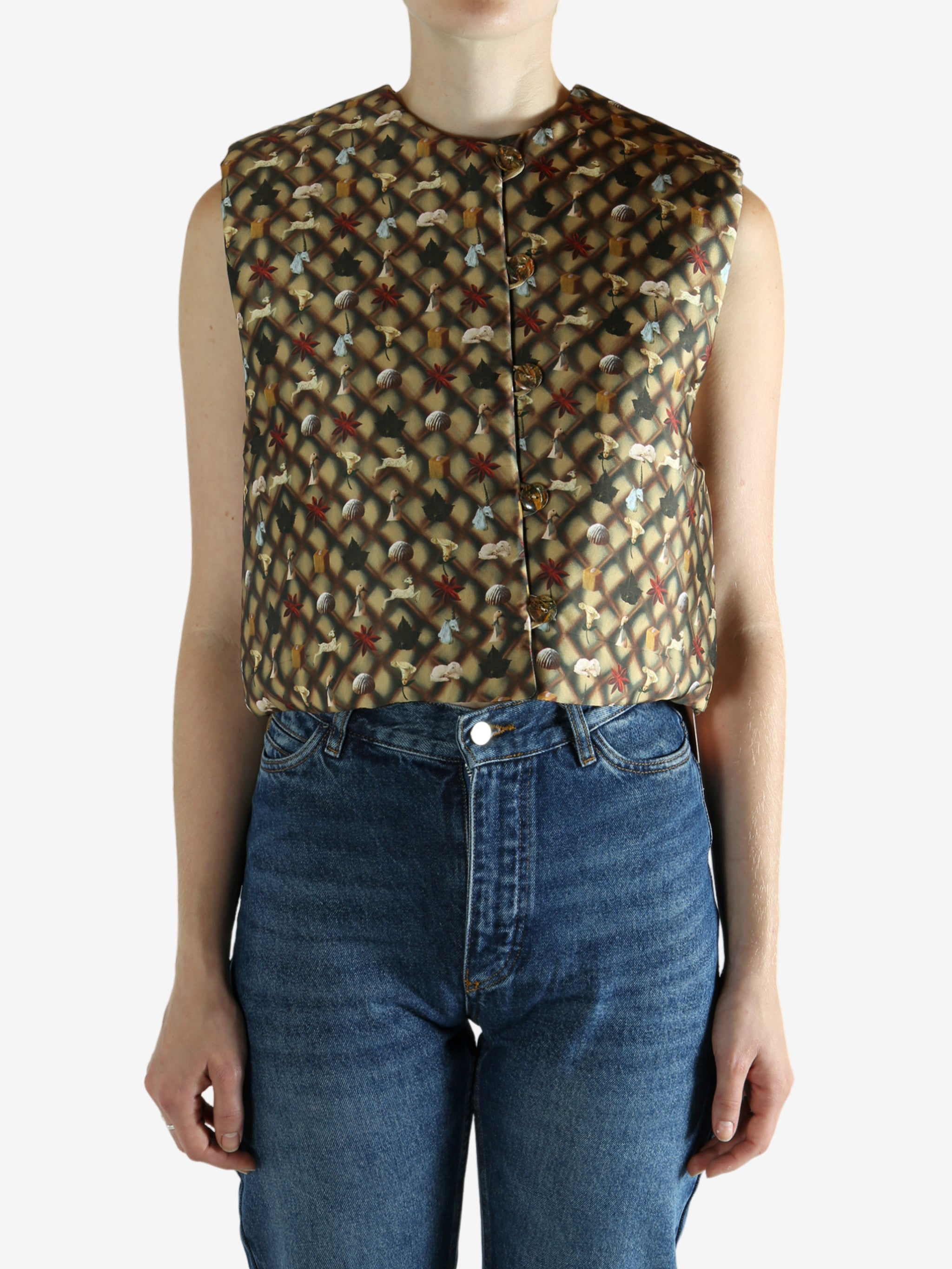 Brown top worn by a person, showing the top's fit