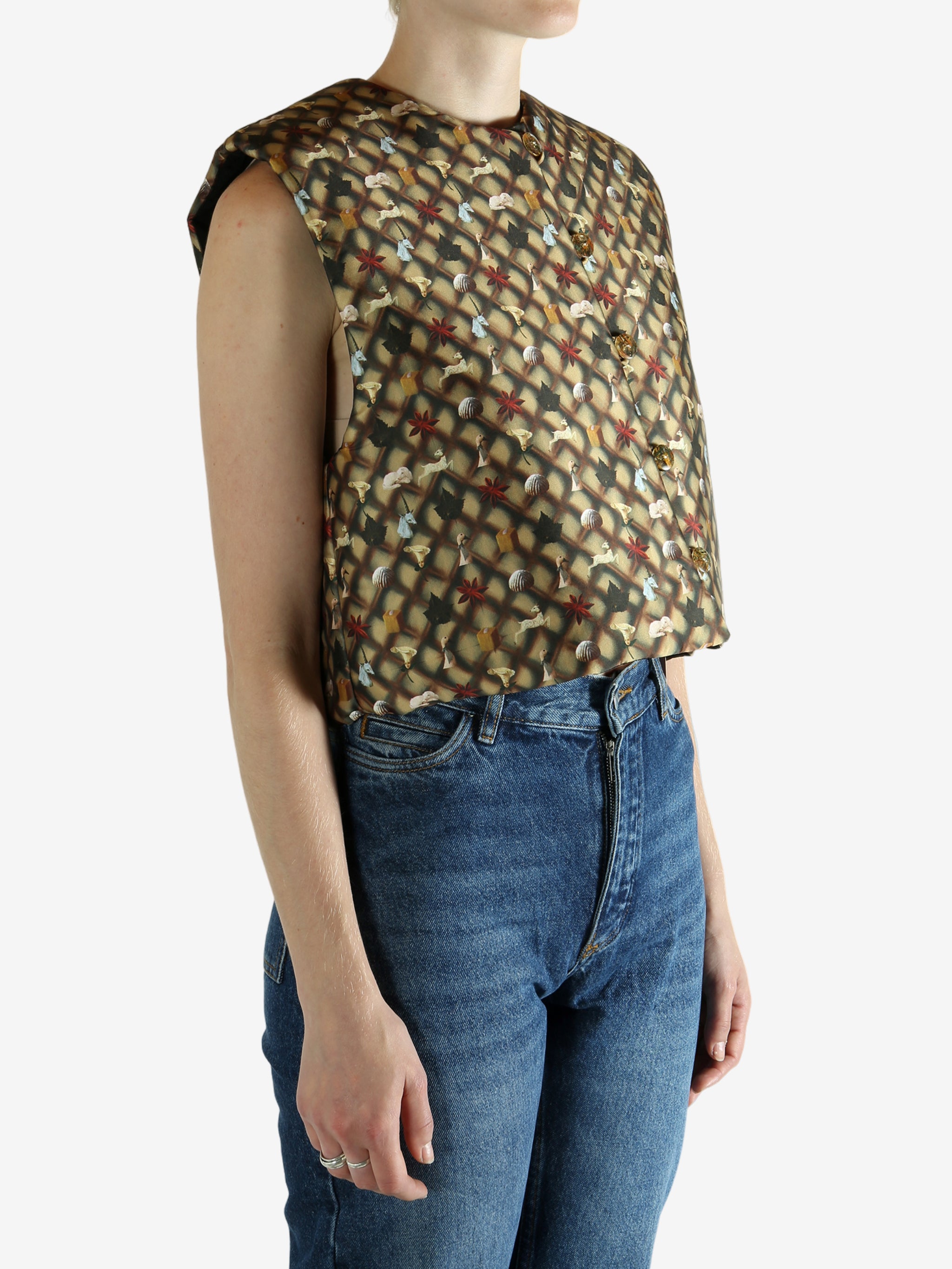 Brown top worn by a person, showing the top's fit