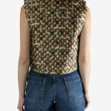 Brown top worn by a person, showing the top's fit