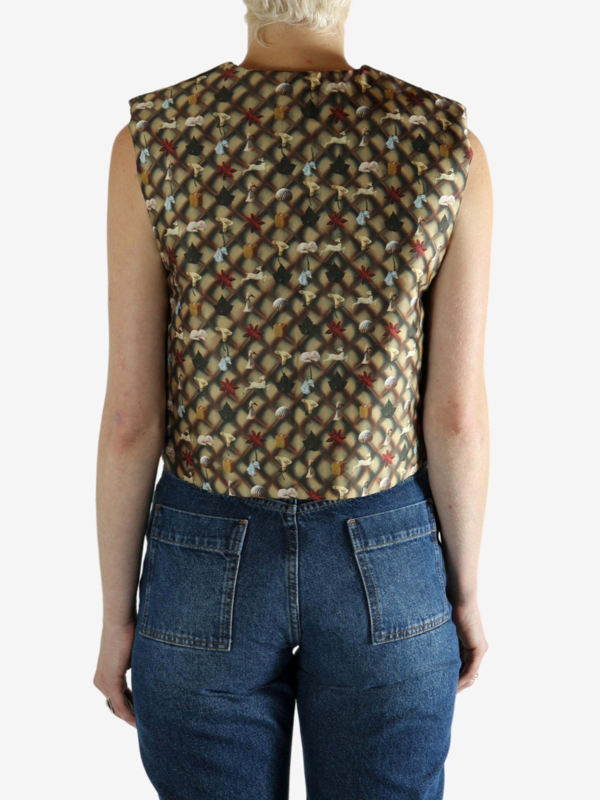 Brown top worn by a person, showing the top's fit