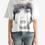 White t-shirt worn by a person, showing the shirt's fit