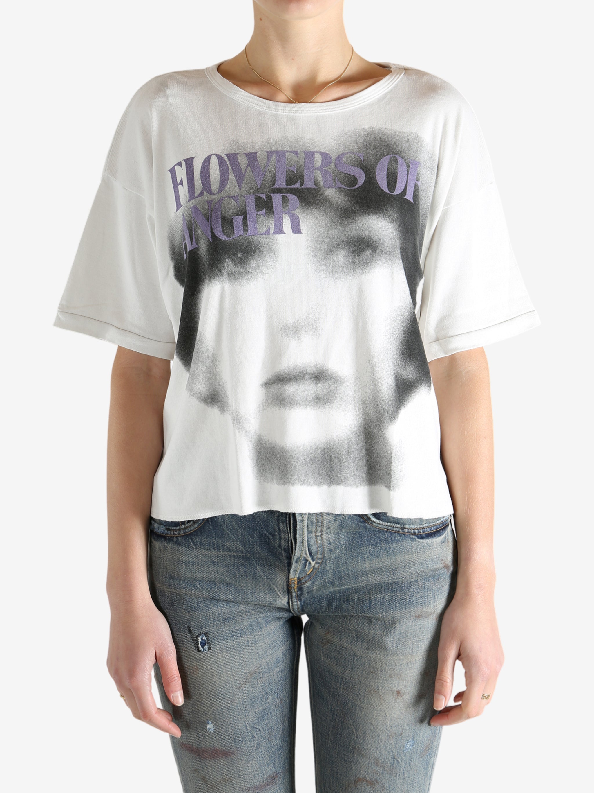 White t-shirt worn by a person, showing the shirt's fit