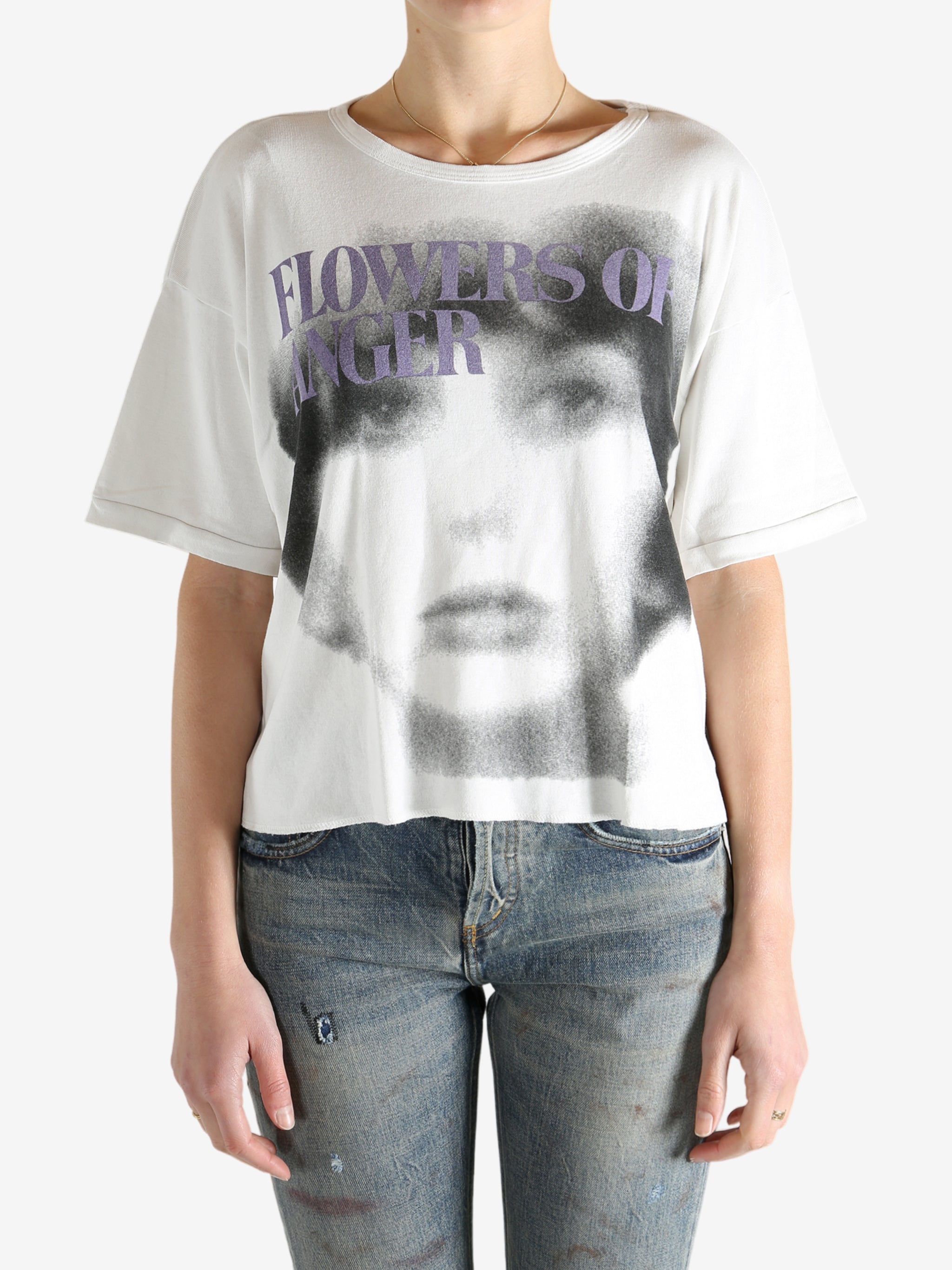 White t-shirt worn by a person, showing the shirt's fit