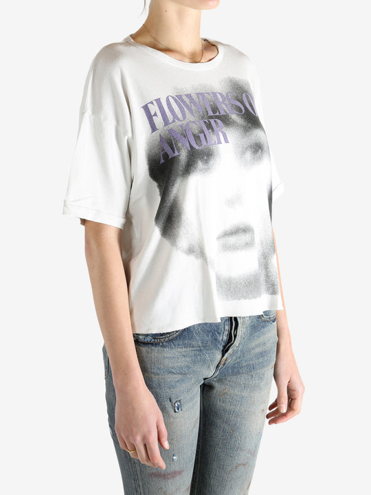 White t-shirt worn by a person, showing the shirt's fit