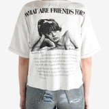 White t-shirt worn by a person, showing the shirt's fit