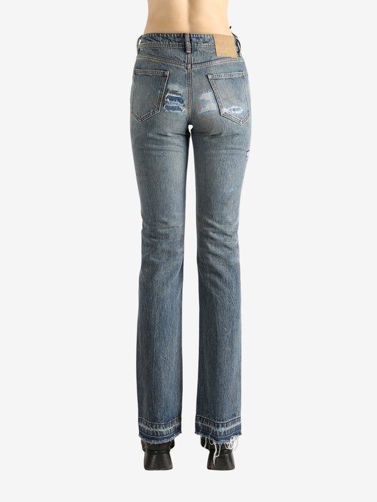 Blue pants worn by a person, showing the pants fit