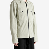 Tan shirt worn by a person, showing the shirt fit