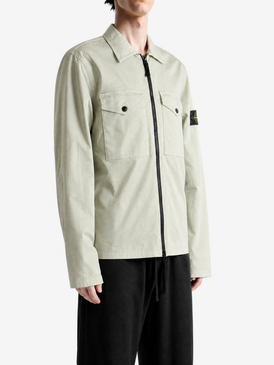 Tan shirt worn by a person, showing the shirt fit