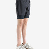 Black shorts worn by a person, showing the shorts fit