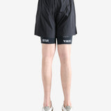 Black shorts worn by a person, showing the shorts fit