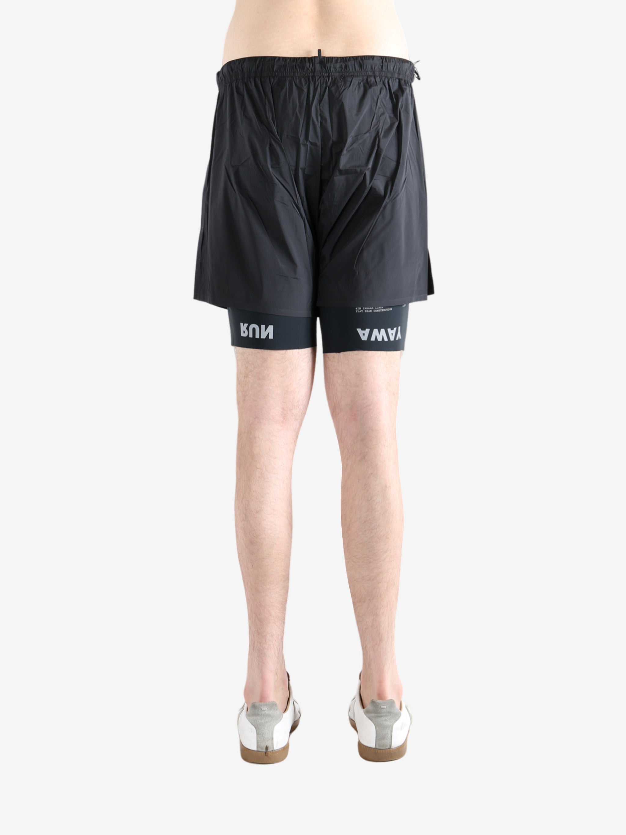 Black shorts worn by a person, showing the shorts fit