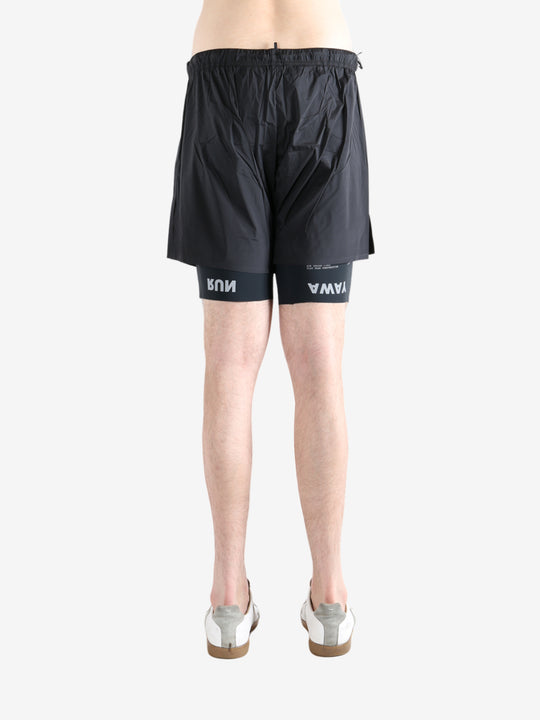 Black shorts worn by a person, showing the shorts fit
