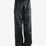 Black pants worn by a person, showing the pants fit