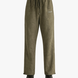 Green pants worn by a person, showing the pants' fit