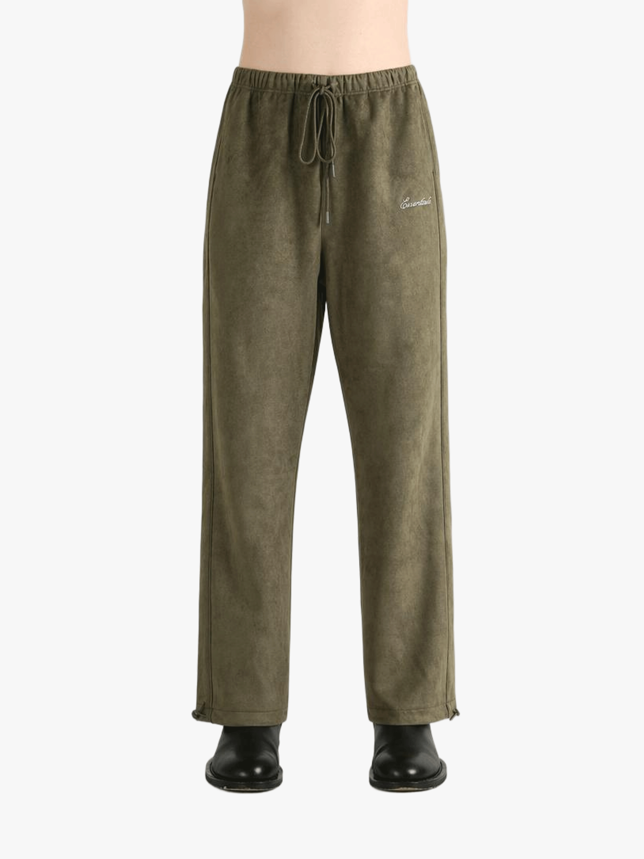 Green pants worn by a person, showing the pants' fit