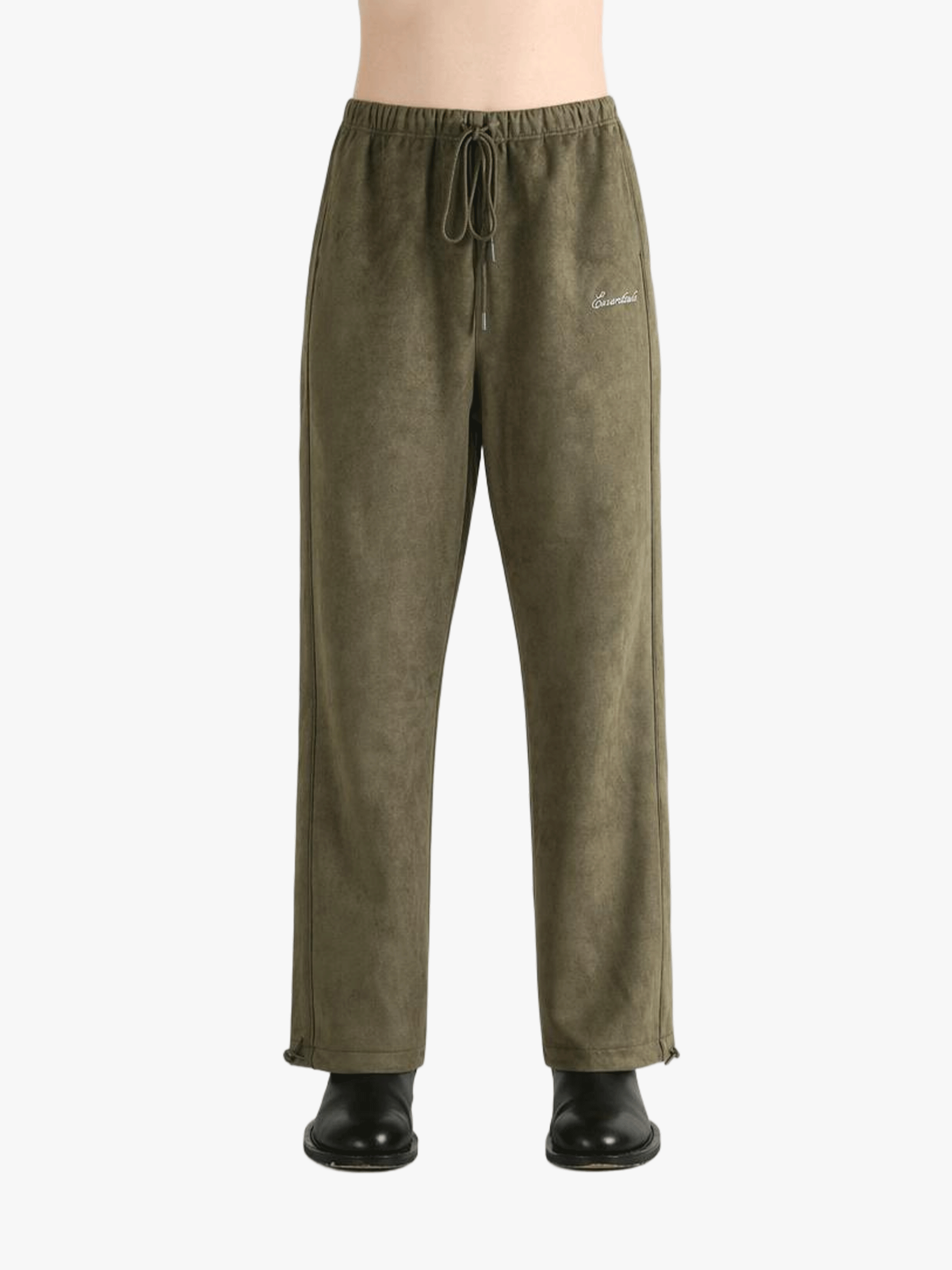Green pants worn by a person, showing the pants' fit