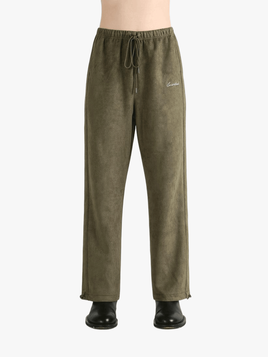 Green pants worn by a person, showing the pants' fit
