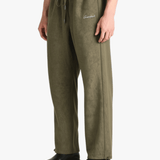 Green pants worn by a person, showing the pants' fit