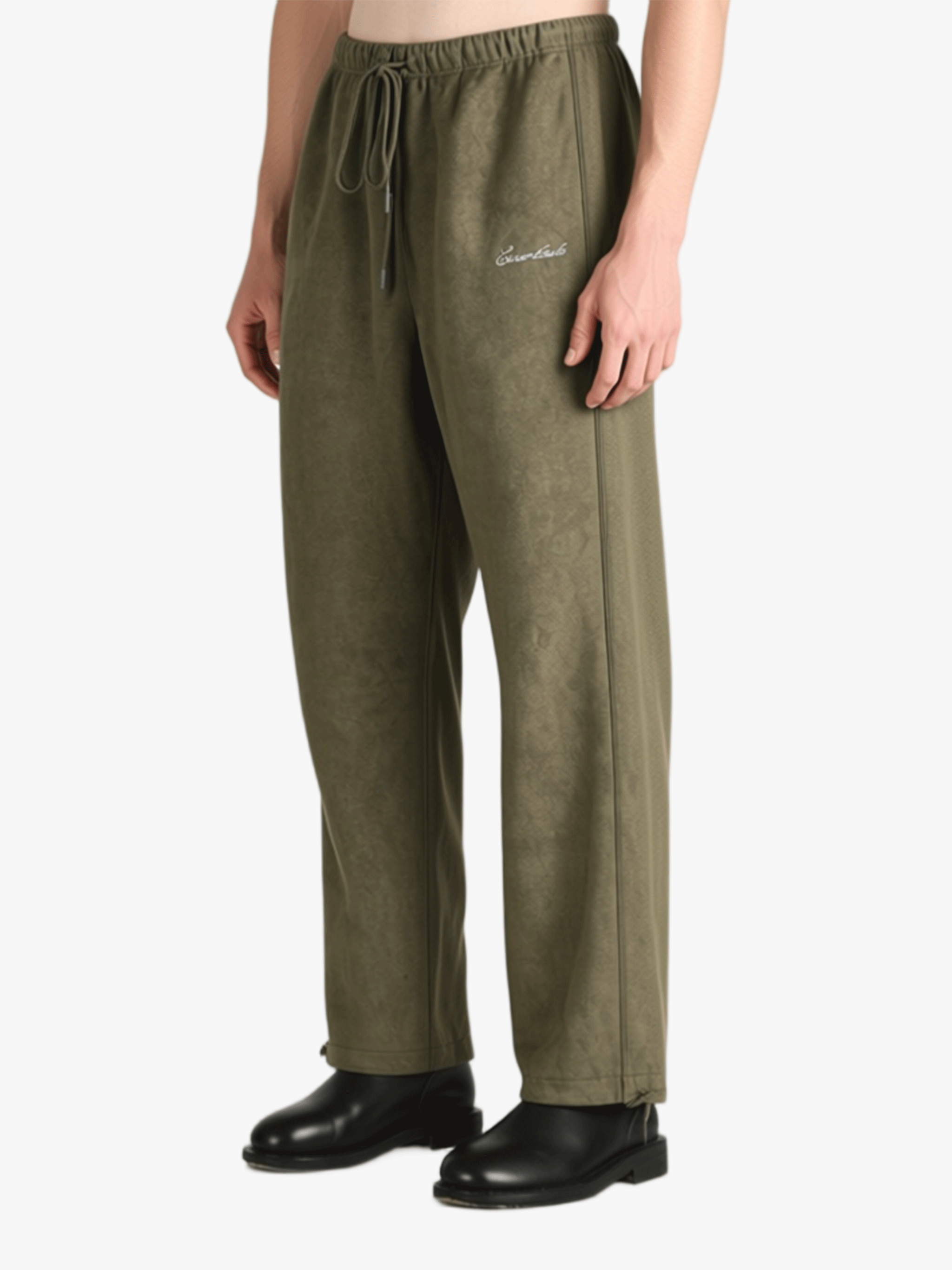 Green pants worn by a person, showing the pants' fit