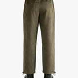 Green pants worn by a person, showing the pants' fit