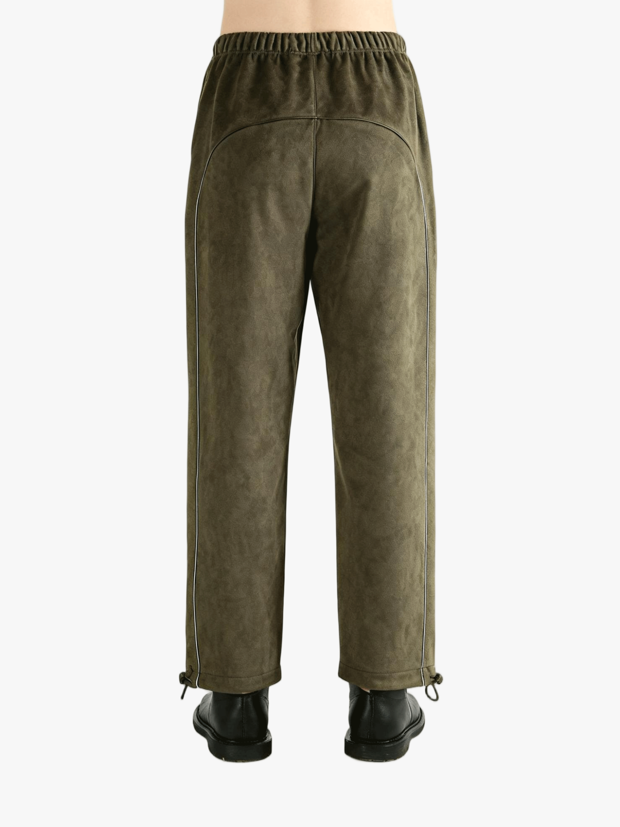 Green pants worn by a person, showing the pants' fit