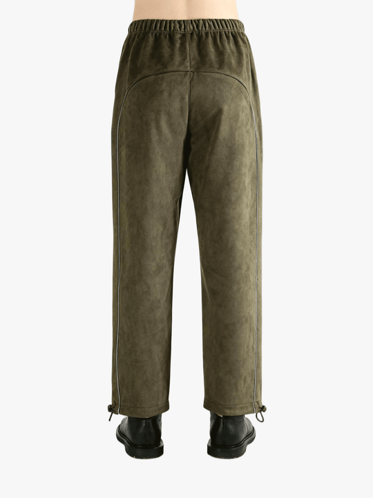 Green pants worn by a person, showing the pants' fit