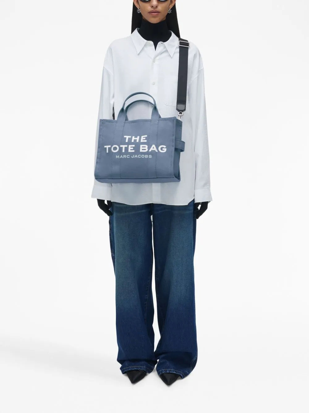 Blue bag worn by a person, showing the bag's fit