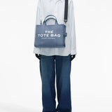 Blue bag worn by a person, showing the bag's fit