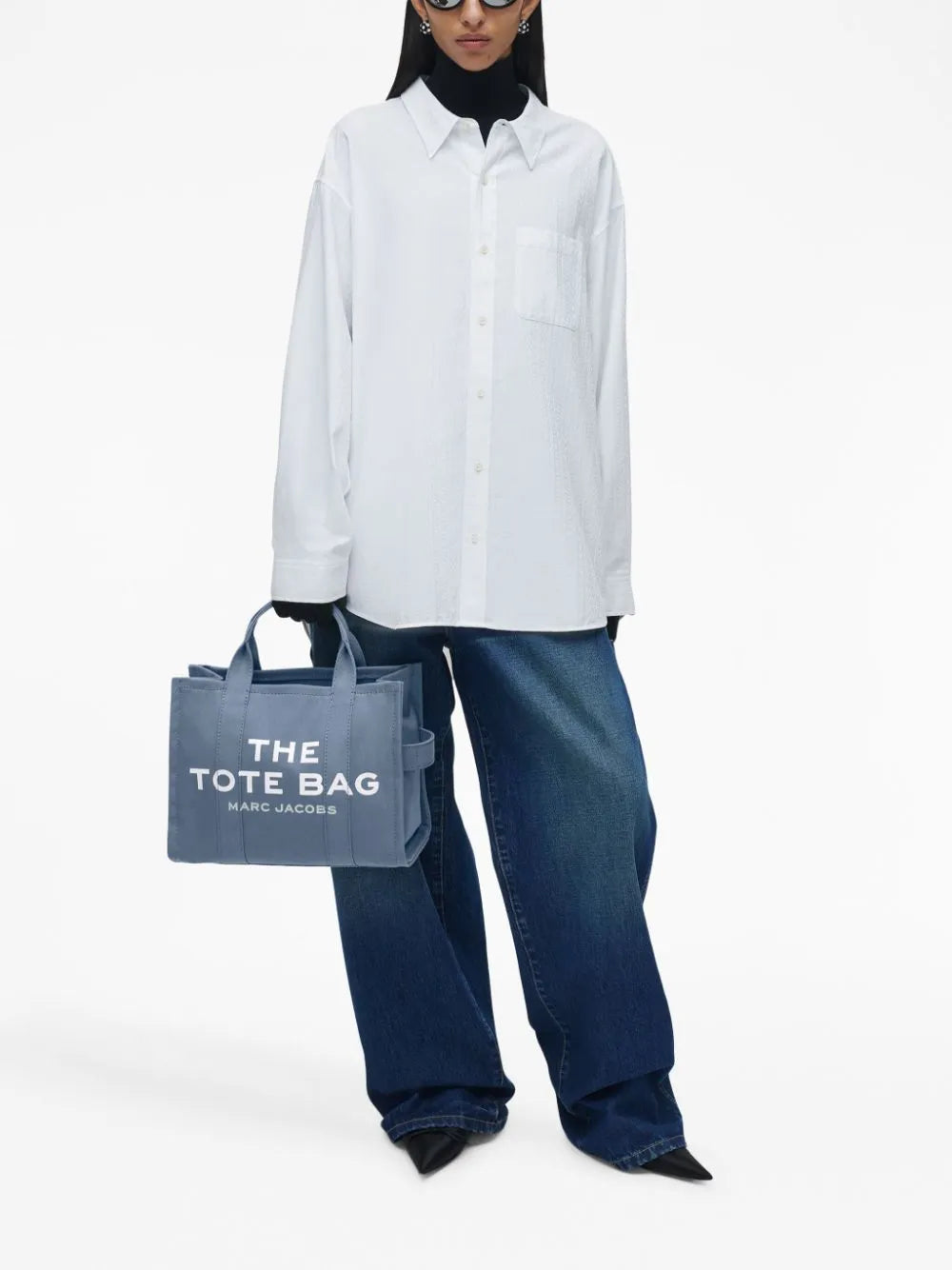 Blue bag worn by a person, showing the bag's fit