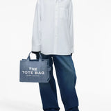 Blue bag worn by a person, showing the bag's fit