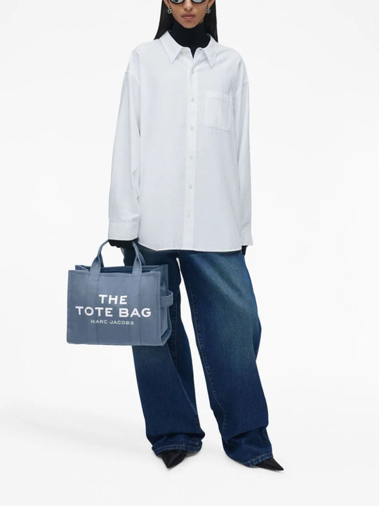 Blue bag worn by a person, showing the bag's fit