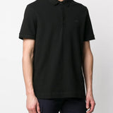 Black shirt worn by a person, showing the shirt's fit