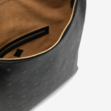 Close up of black bag, showing texture of the leather fabric