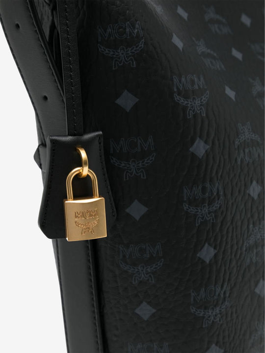 Close up of black bag, showing texture of the leather fabric