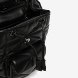 Close up of black bag, showing texture of the leather fabric