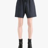 Black shorts worn by a person, showing the shorts' fit