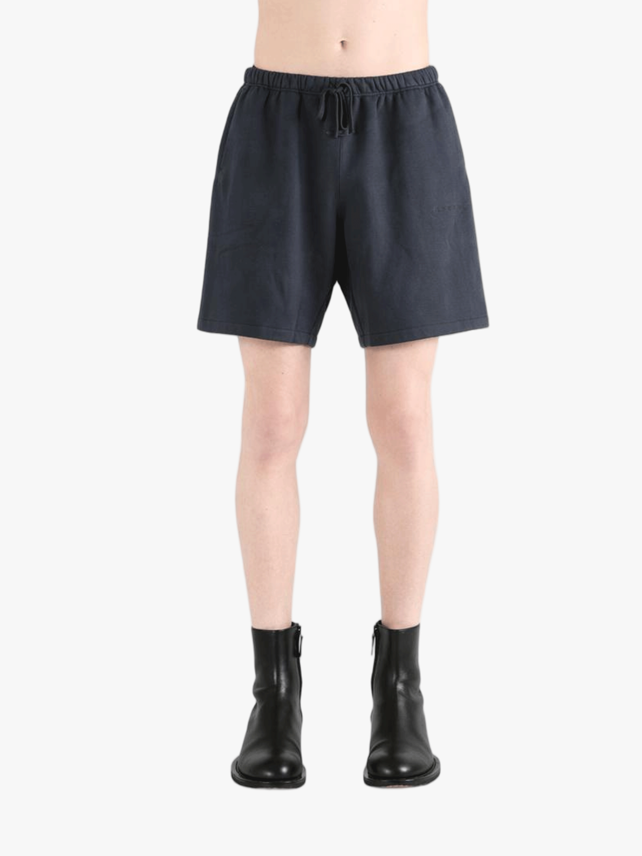 Black shorts worn by a person, showing the shorts' fit