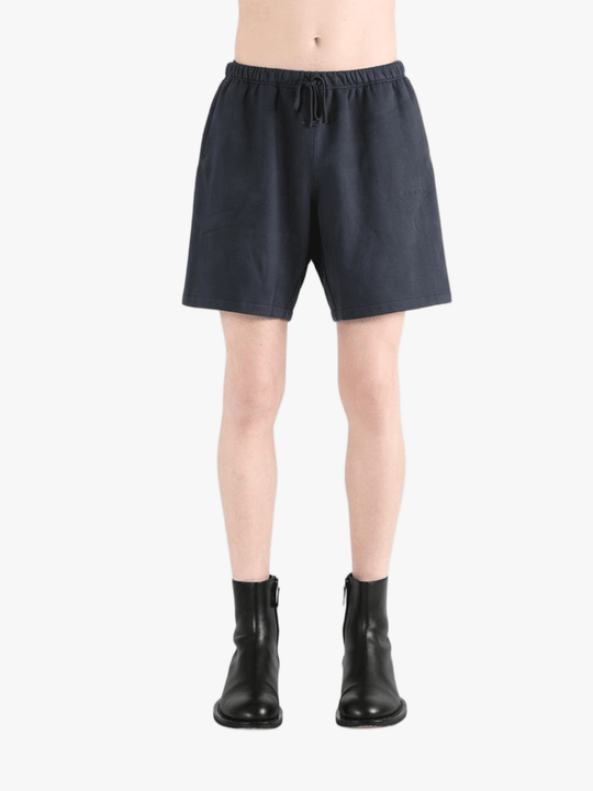 Black shorts worn by a person, showing the shorts' fit
