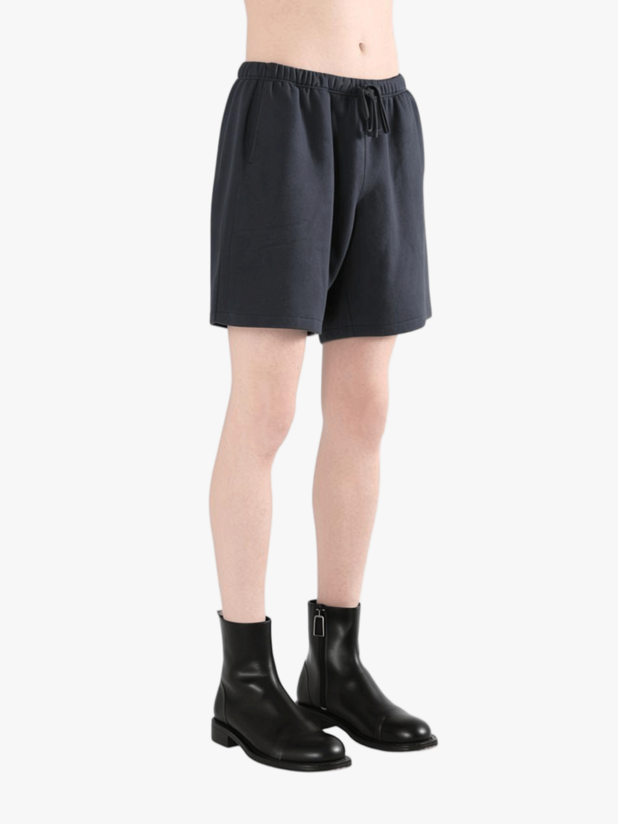 Black shorts worn by a person, showing the shorts' fit