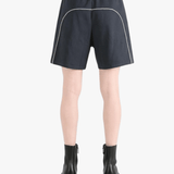 Black shorts worn by a person, showing the shorts' fit