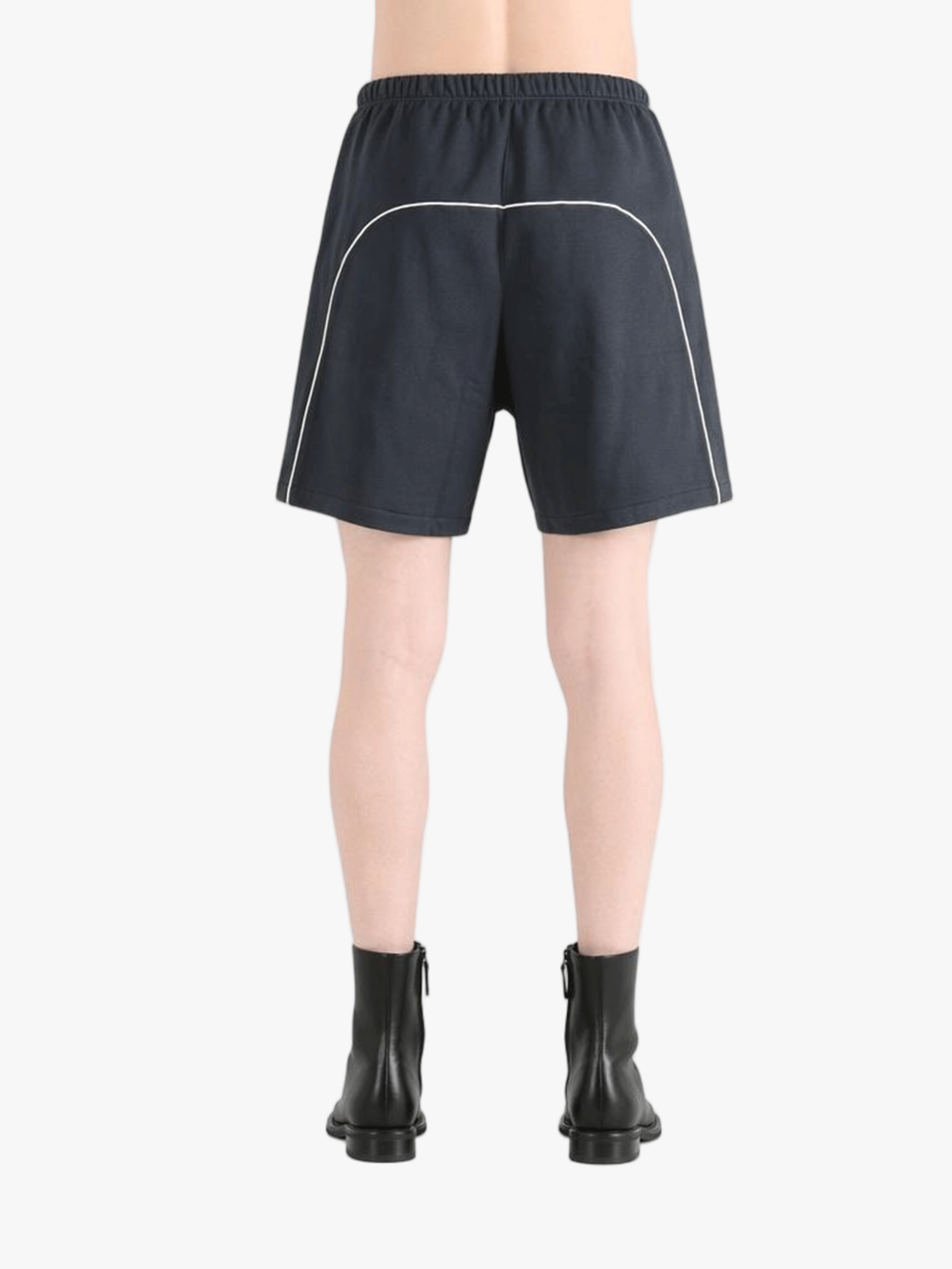 Black shorts worn by a person, showing the shorts' fit