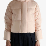 Pink jacket worn by a person, showing the jacket fit