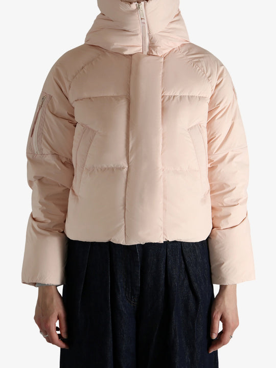 Pink jacket worn by a person, showing the jacket fit