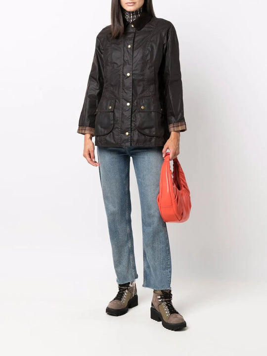 Brown jacket worn by a person, showing the jacket's fit