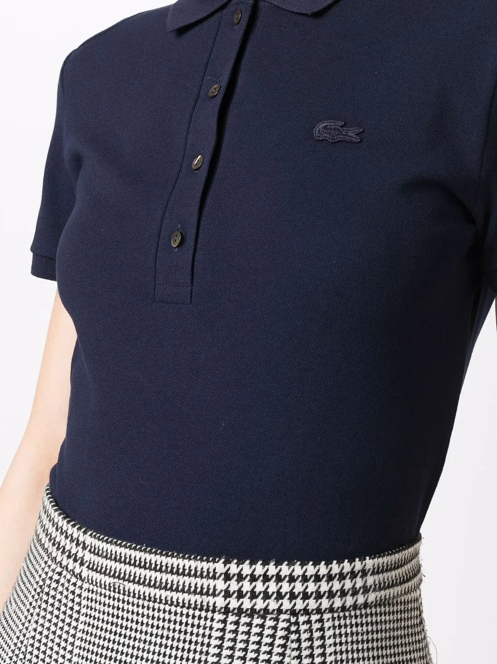 Navy shirt worn by a person, showing the shirt's fit