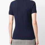 Navy shirt worn by a person, showing the shirt's fit