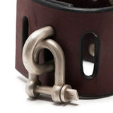 Close up of red bracelet, showing texture of the leather fabric